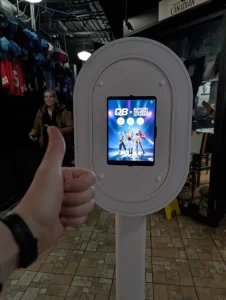 Custom branded start screen on the photo booth showing the K-Pop Demon Hunter theme for a corporate party.