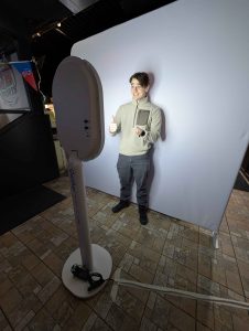 Wide view of the setup at QB Sports Bar featuring the photo booth for a corporate family gathering.