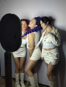 K Pop Demon Hunters cosplayers posing at the Aura photo booth during a corporate kids event in Burlington.